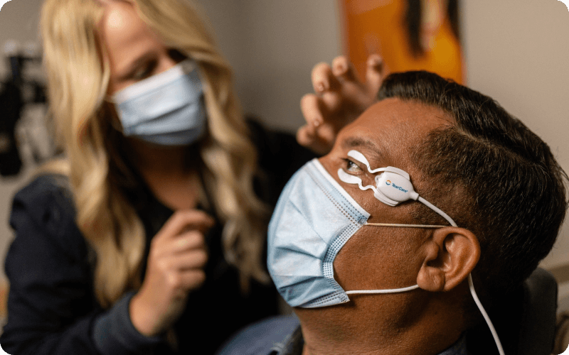 A male patient receiving treatment for blepharitis.