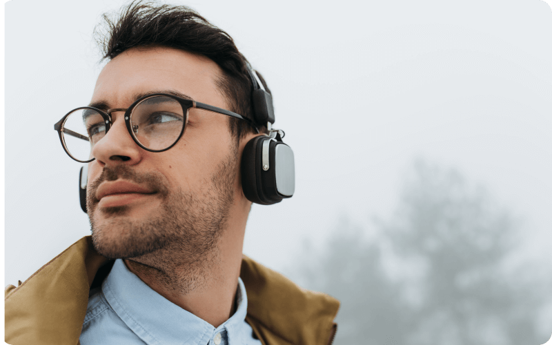 Man wearing glasses and headphones