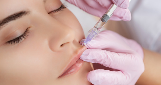 Woman having lip injection